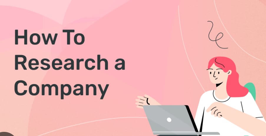 The image shows a graphic with the title "How To Research a Company" in large black text on the left side. On the bottom right, there's an illustration of a woman with pink hair sitting in a green chair, working on a silver laptop. She's gesturing with her right hand as if explaining something. The background is a pink gradient with some white curved lines.