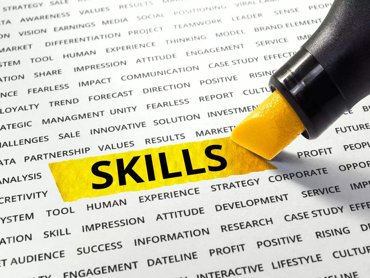 The image shows a close-up of a page with lots of business-related words printed on it in black text. A marker is highlighting the word "SKILLS" in yellow.
Some of the surrounding words include:
- STRATEGY
- AWARENESS
- VALUES
- VISION
- EARNINGS
- DIFFERENTIATION
- PROJECT
- TEAMWORK
- LEADER
- TOOL
- HUMAN
- EXPERIENCE
- ENGAGEMENT
- IMPRESSION
- COMMUNICATION
- FEARLESS
- TREND
- MANAGEMENT
- INNOVATIVE
- SOLUTION
- PARTNERSHIP
- DEVELOPMENT
- RESEARCH