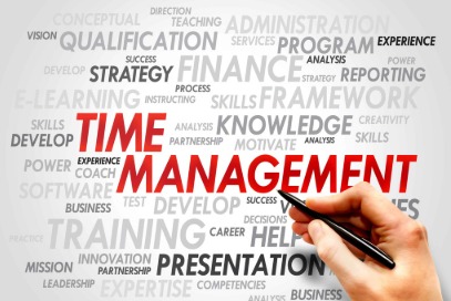The image shows a hand holding a pen and highlighting the words “Time Management” in red. Around it, there are related words like knowledge, finance, strategy, learning, skills, presentation, experience, and success, written in different sizes and shades. The image represents the importance of managing time to improve productivity, skills, and overall professional growth.
